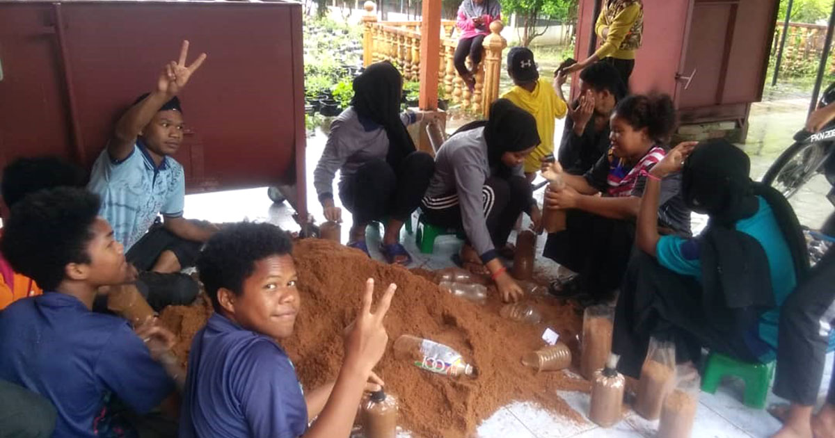 Oyster mushroom block preparation activity with indigenous peoples at Sungai Rual