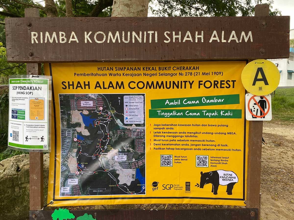 Shah Alam Community Forest signboard at Setia Alam trail featuring the trail map and other useful information